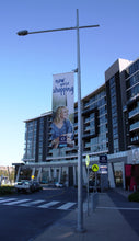 Load image into Gallery viewer, Stockland use our light pole banner brackets
